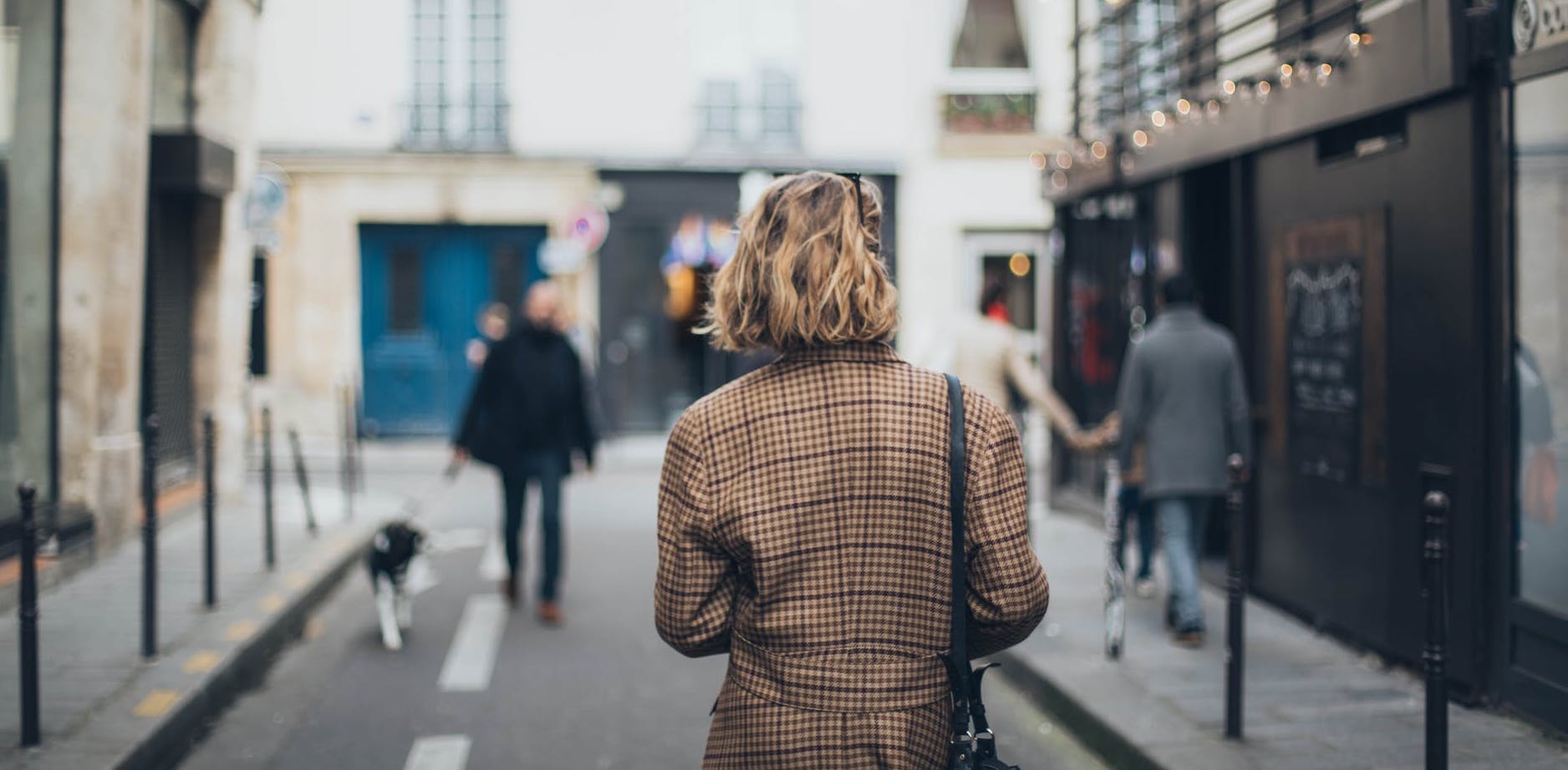 woman on street using phone